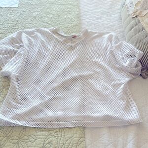 Two football practice shirts. One brand Fab-Knit, one brand Schutt.